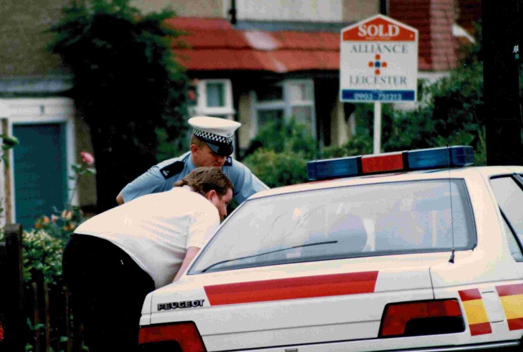 Price talking with Police by car